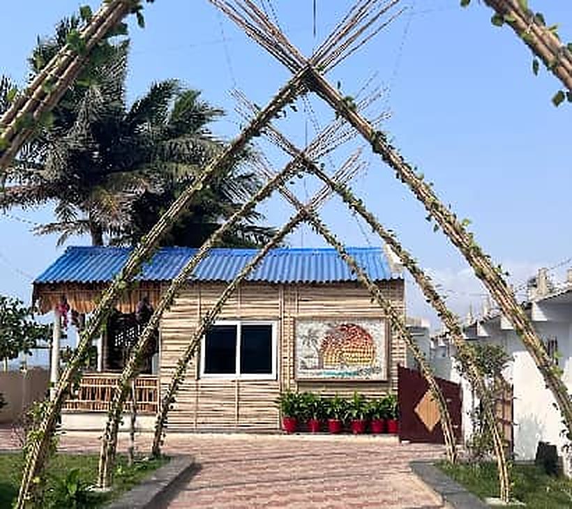 Bamboo cottage with arch at Myra Golden Beach Resort