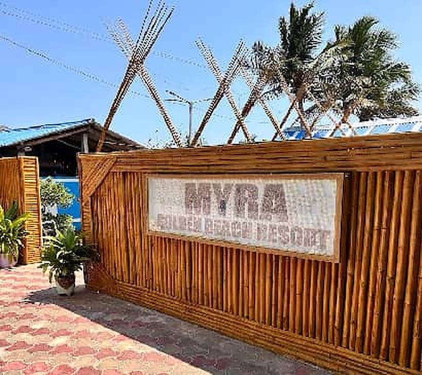 Bamboo wall sign at Myra Golden Beach Resort