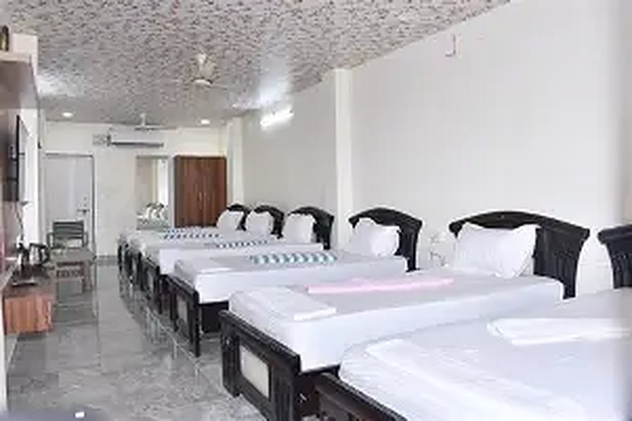 Dormitory room with many beds at Myra Golden Beach Resort, Chirala